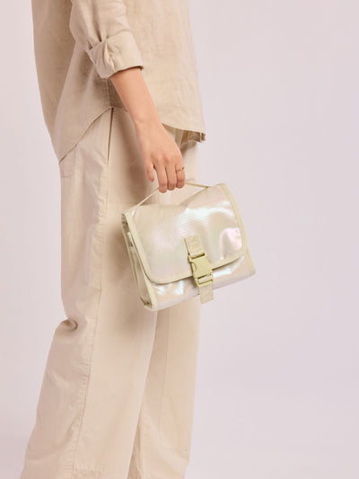CALPAK Terra Hanging Toiletry Bag in shiny white Moonbeam with front buckle; THY2201-MOONBEAM view 2