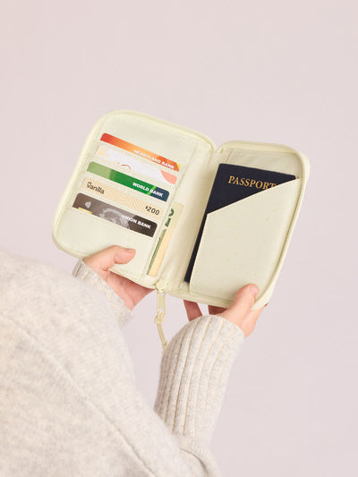 Front side of CALPAK Terra Zip Passport Wallet in light green Celadon; ATPW2501-CELADON view 2