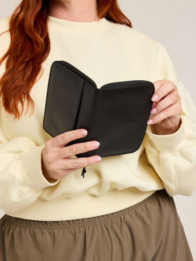 CALPAK Terra Zippered Passport Wallet in black Matte Obsidian front view; ATPW2501-MATTE-OBSIDIAN view 2