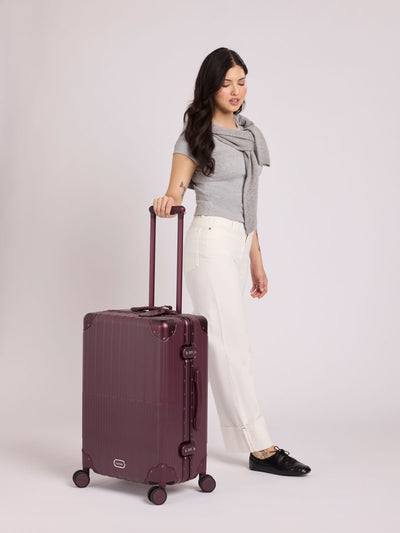 CALPAK Vault Luggage in Medium Dark Cherry deep red hard-shell spinner suitcase with a ribbed vertical design, shown from the front against a clean white background; LVT1024-DARK-CHERRY view 2