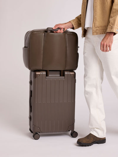 CALPAK Vault luggage brown Mushroom hard-shell spinner suitcase with a ribbed vertical design, shown from the front against a clean white background; LVT1024-MUSHROOM view 2