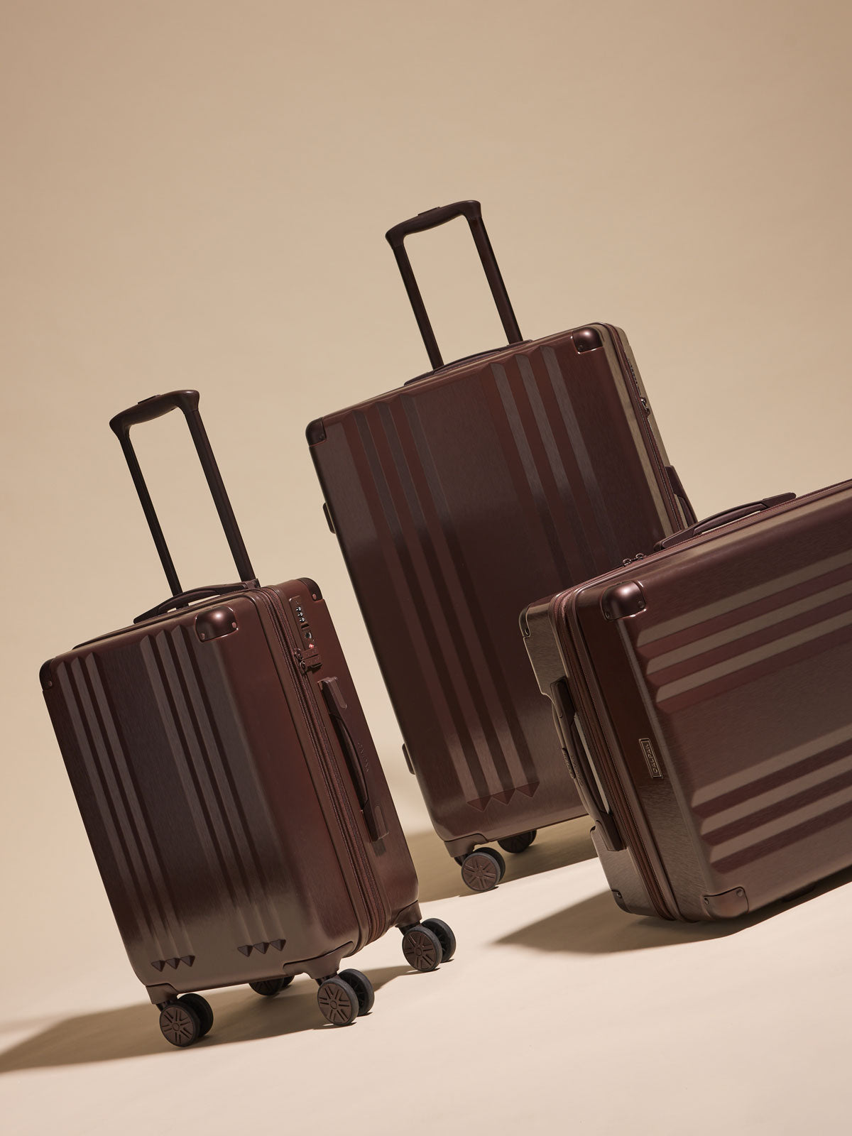 CALPAK Ambeur 3 piece luggage set in brown Walnut that includes a Carry-On Luggage, Medium Luggage, and large Luggage; LAM3000-WALNUT