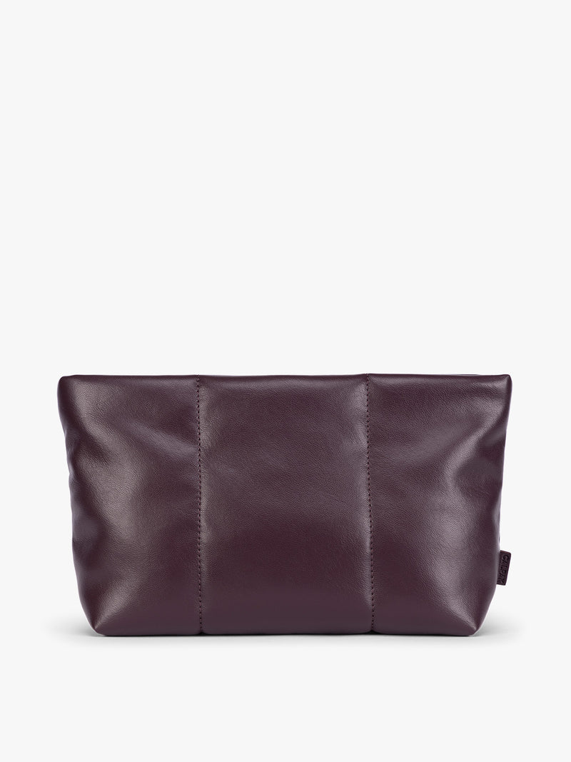 CALPAK dark red Dark Cherry vegan leather pouch bag with a structured rectangular shape and vertical stitched panel details, shown against a plain white background
