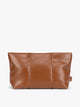 CALPAK light brown Honey Brown vegan leather pouch bag with a structured rectangular shape and vertical stitched panel details, shown against a plain white background; ZLPM2601-HONEY-BROWN-PU