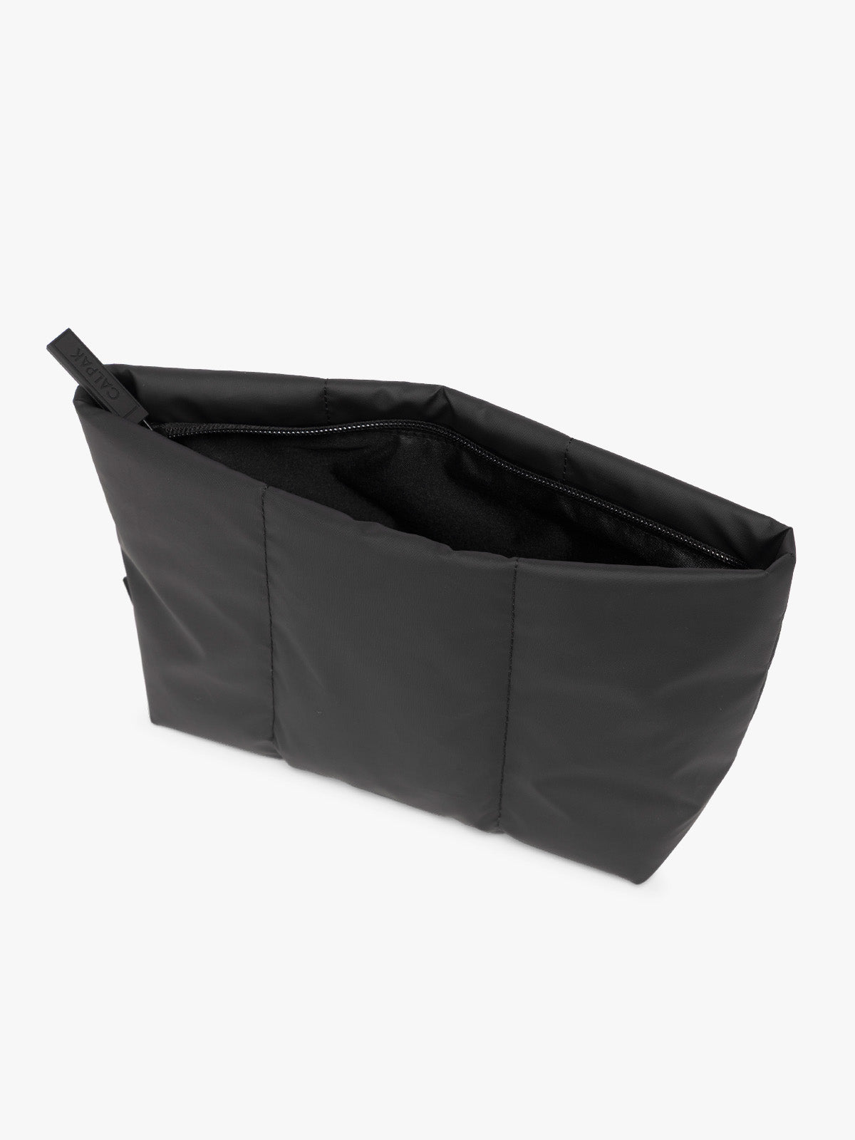 Top side view of Black CALPAK Luka 2 Quart Zip Pouch bag with stitched paneling and top zipper, shown against a plain white background; ZLPM2601-MATTE-BLACK
