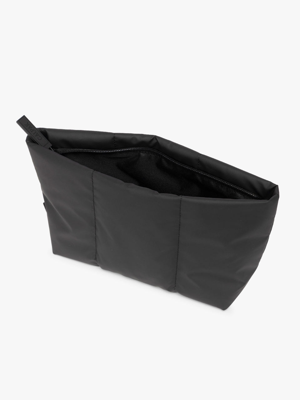 Top side view of Black CALPAK Luka 2 Quart Zip Pouch bag with stitched paneling and top zipper, shown against a plain white background; ZLPM2601-MATTE-BLACK