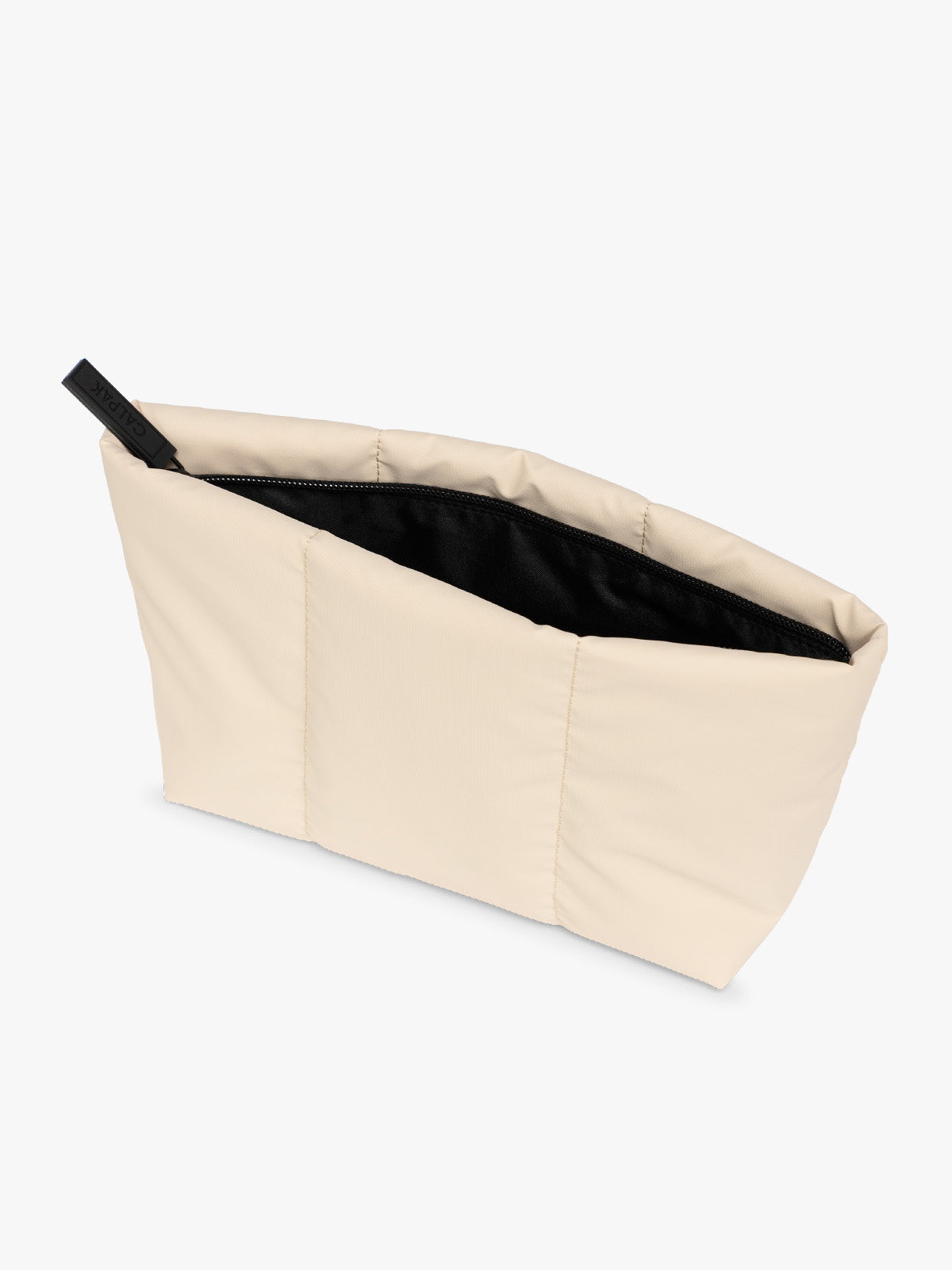 Top side view of a beige Oatmeal CALPAK Luka 2 Quart Zip Pouch bag with stitched paneling and top zipper, shown against a plain white background; ZLPM2601-OATMEAL