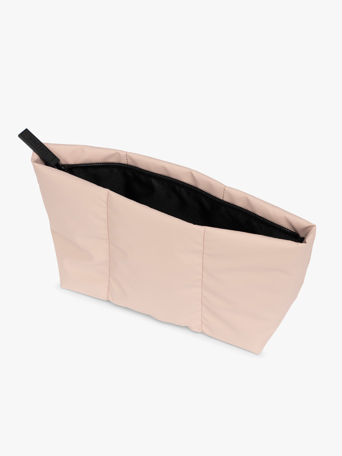Top side view of a light pink Rose Quartz CALPAK Luka 2 Quart Zip Pouch bag with stitched paneling and top zipper, shown against a plain white background; ZLPM2601-ROSE-QUARTZ