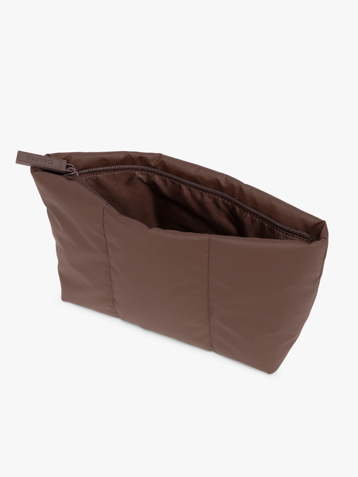 Top side view of a dark brown Walnut CALPAK Luka 2 Quart Zip Pouch bag with stitched paneling and top zipper, shown against a plain white background; ZLPM2601-WALNUT
