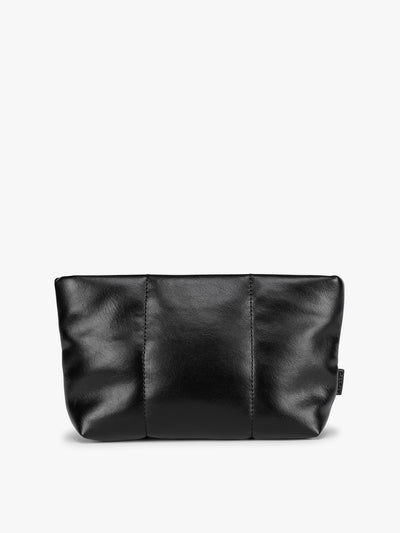 A CALPAK Luka 1 quart black vegan leather pouch bag with a quilted, padded design and a small black brand tag on the right side, shown against a plain white background; ZLPS2601-BLACK-PU view 1