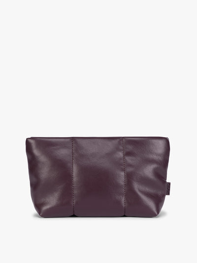 A CALPAK Luka 1 quart deep plum Dark Cherry vegan leather pouch bag with a quilted, padded design and a small brand tag on the right side, shown against a plain white background; ZLPS2601-DARK-CHERRY-PU view 1