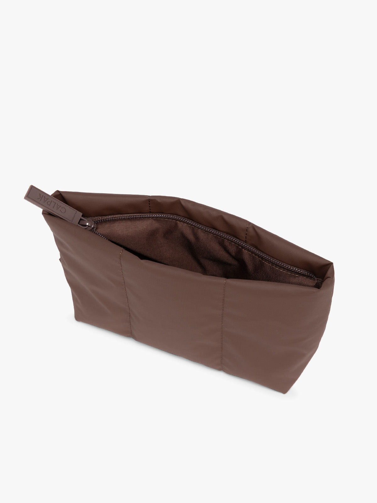 Top side view of a dark brown Walnut colored CALPAK Luka 1 Quart Pouch with vertical stitched paneling and top zipper, shown against a plain white background; ZLPS2601-WALNUT