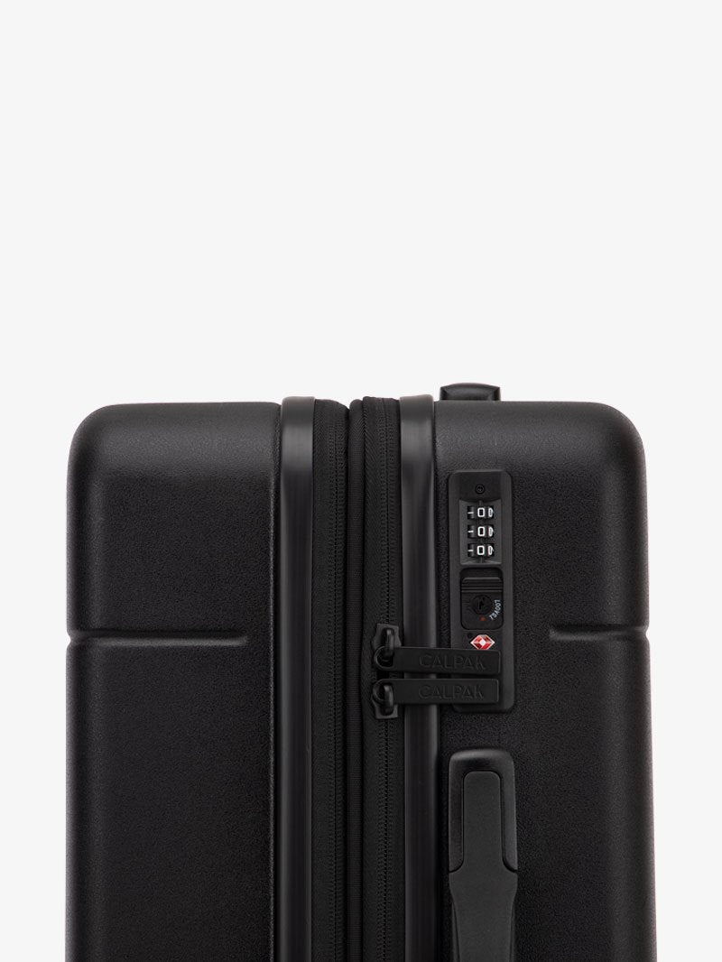 TSA lock of black CALPAK Hue hard shell rolling carry-on luggage; LHU1020-NP-BLACK