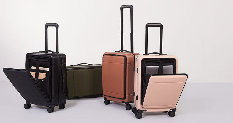 CALPAK Hue Front Pocket Carry On Luggage in Black, Pink, Orange and Green