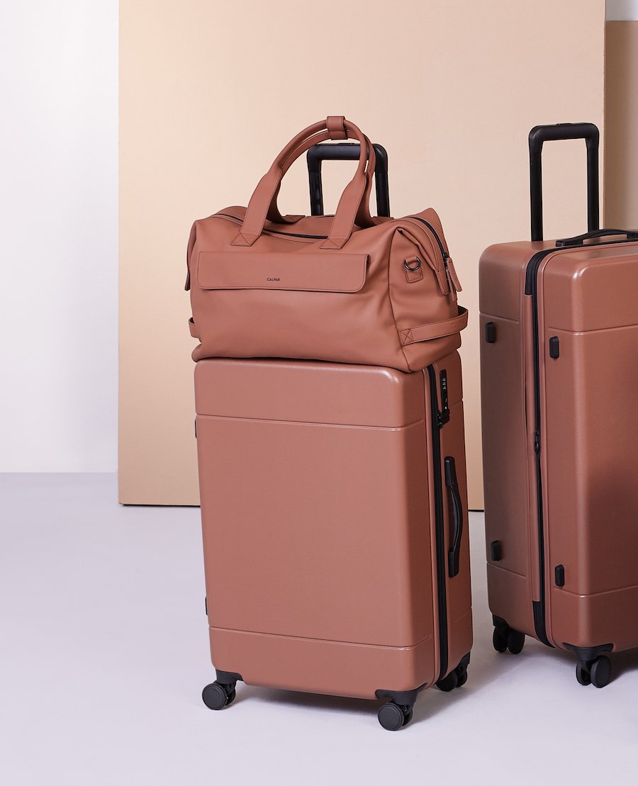 medium 26 inch CALPAK Hue hard shell luggage in brown hazel color; LHU1024-HAZEL