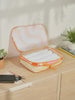 CALPAK compression packing cubes with handles in wavy orange print; PCC2201-RETRO-SUNSET