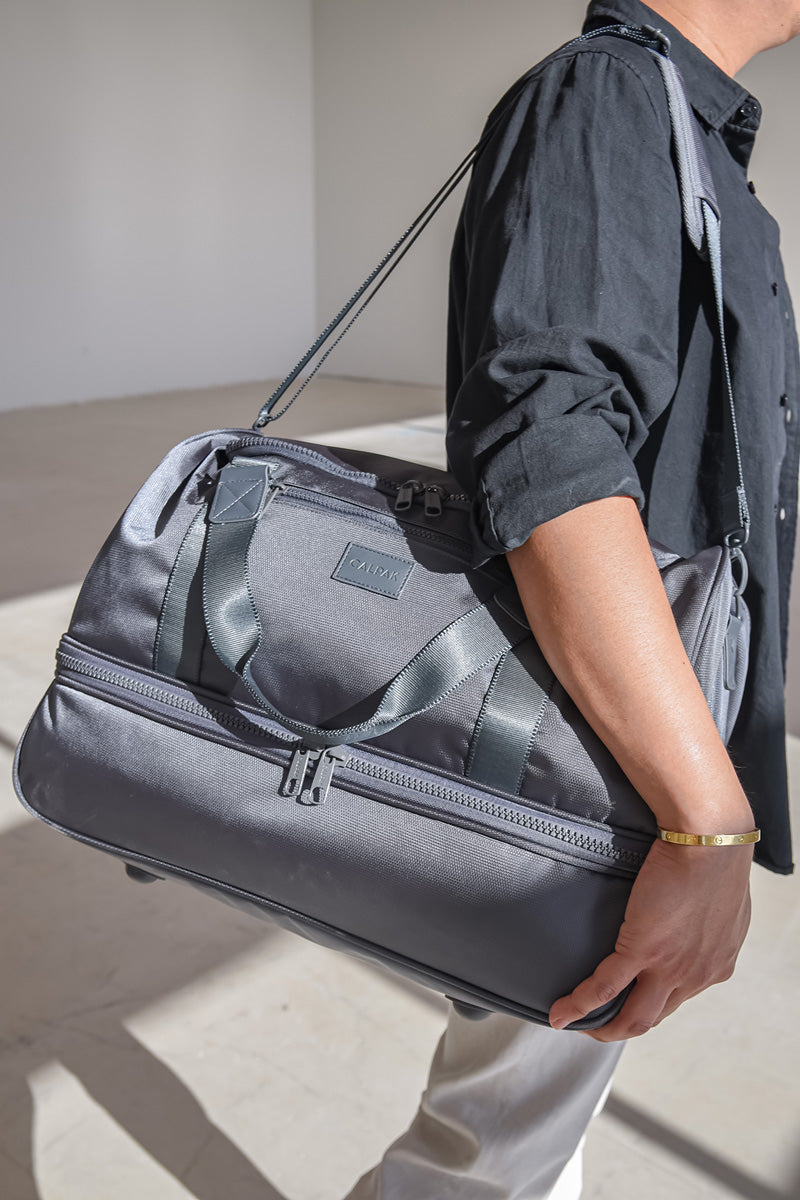 CALPAK Stevyn duffel bag with shoe compartment in slate color; DST7019-SLATE