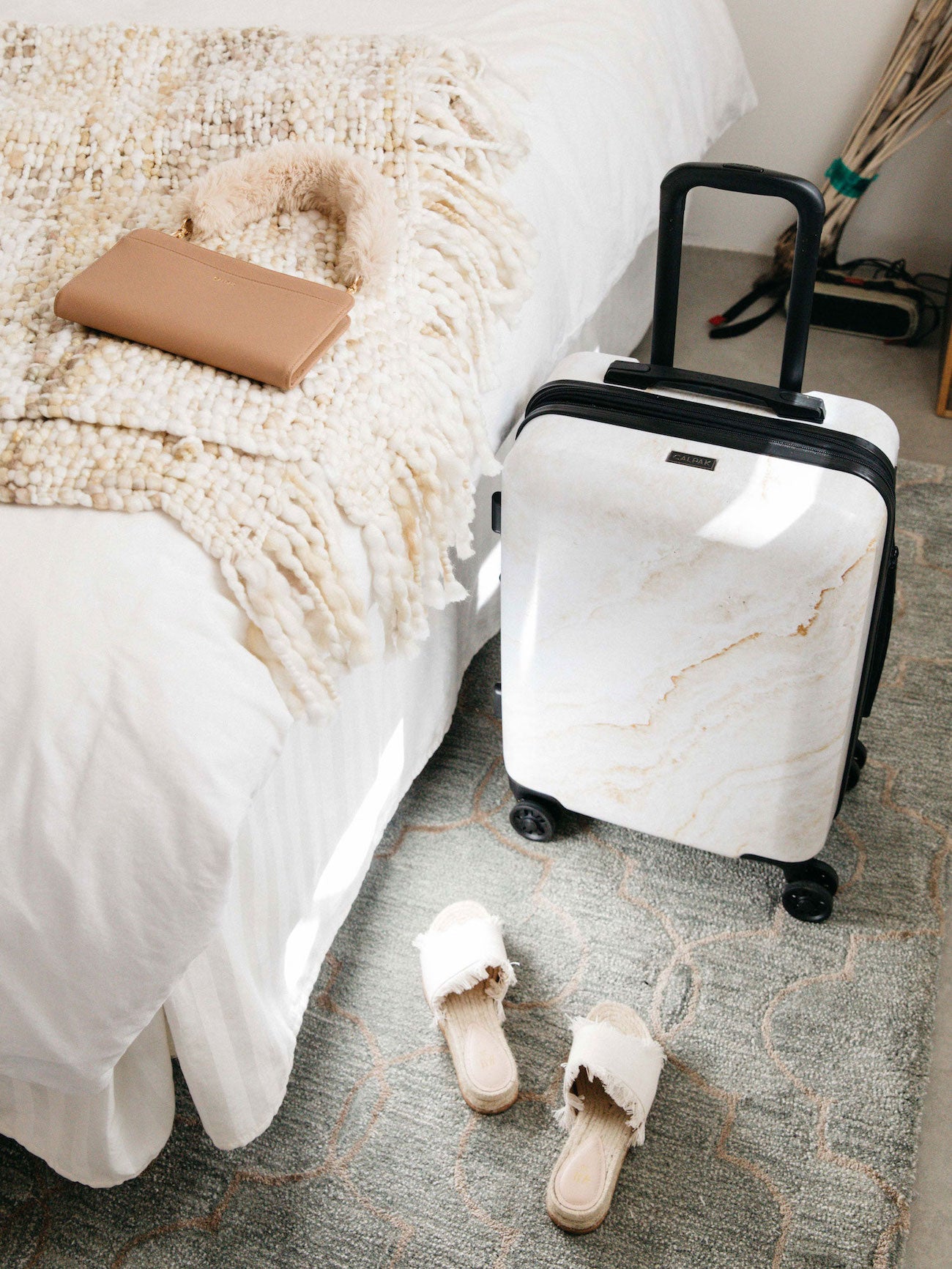CALPAK gold marble hard shell carry-on suitcase for travel