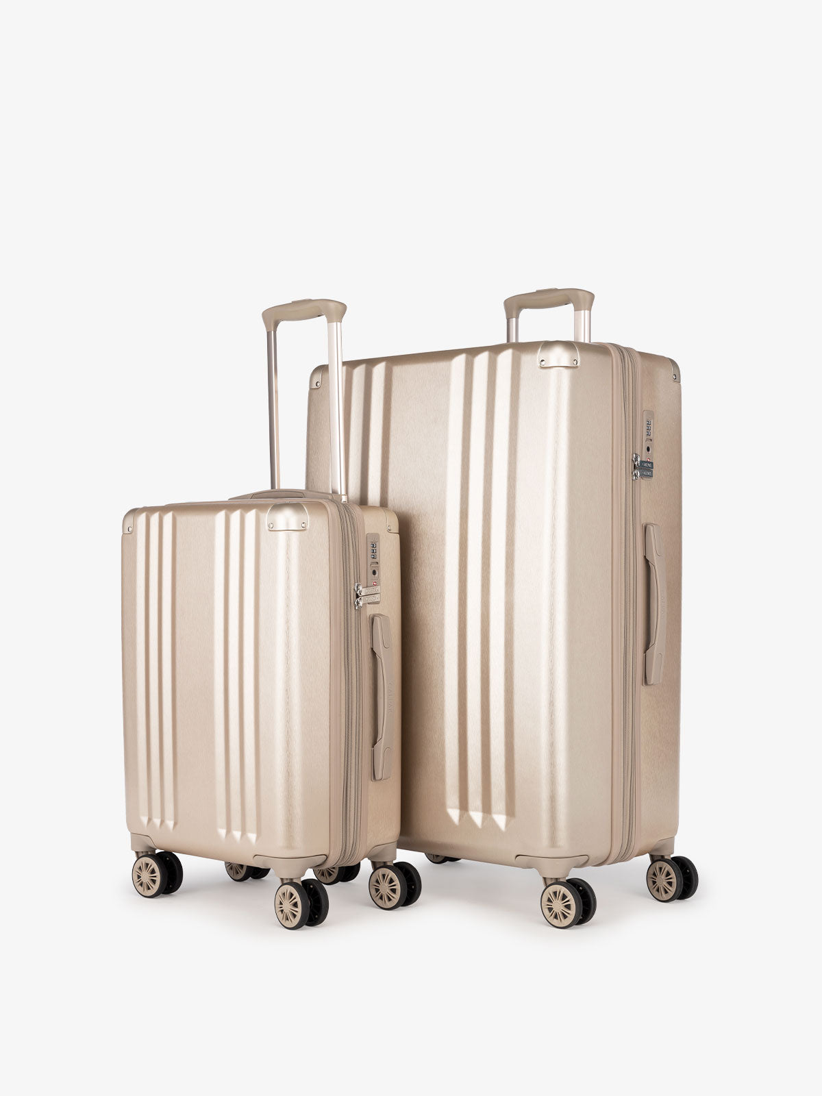 CALPAK Ambeur: 2 piece lightweight expandable gold hardside spinner luggage set for women; LAM2000-GOLD