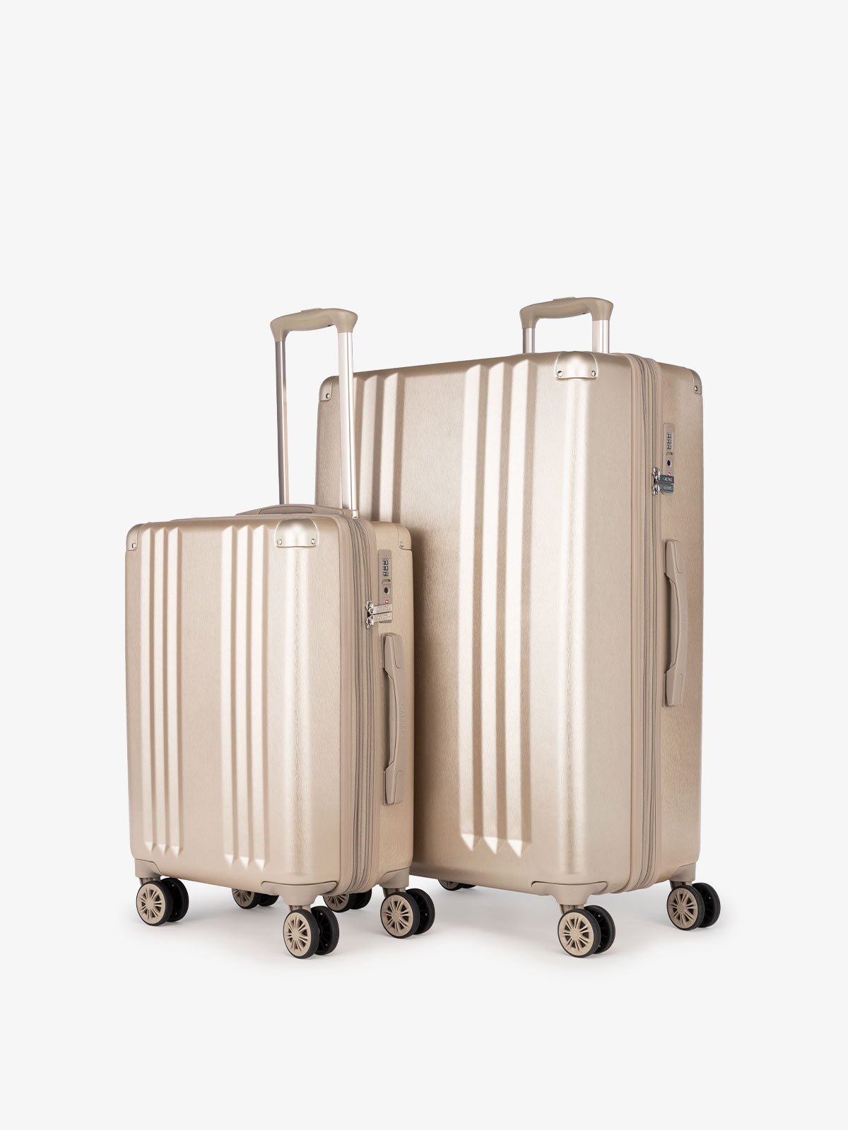 CALPAK Ambeur: 2 piece lightweight expandable gold hardside spinner luggage set for women