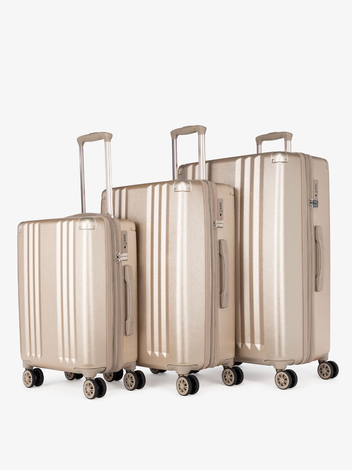 CALPAK Ambeur: 3 piece lightweight expandable gold hard shell luggage set with carry on