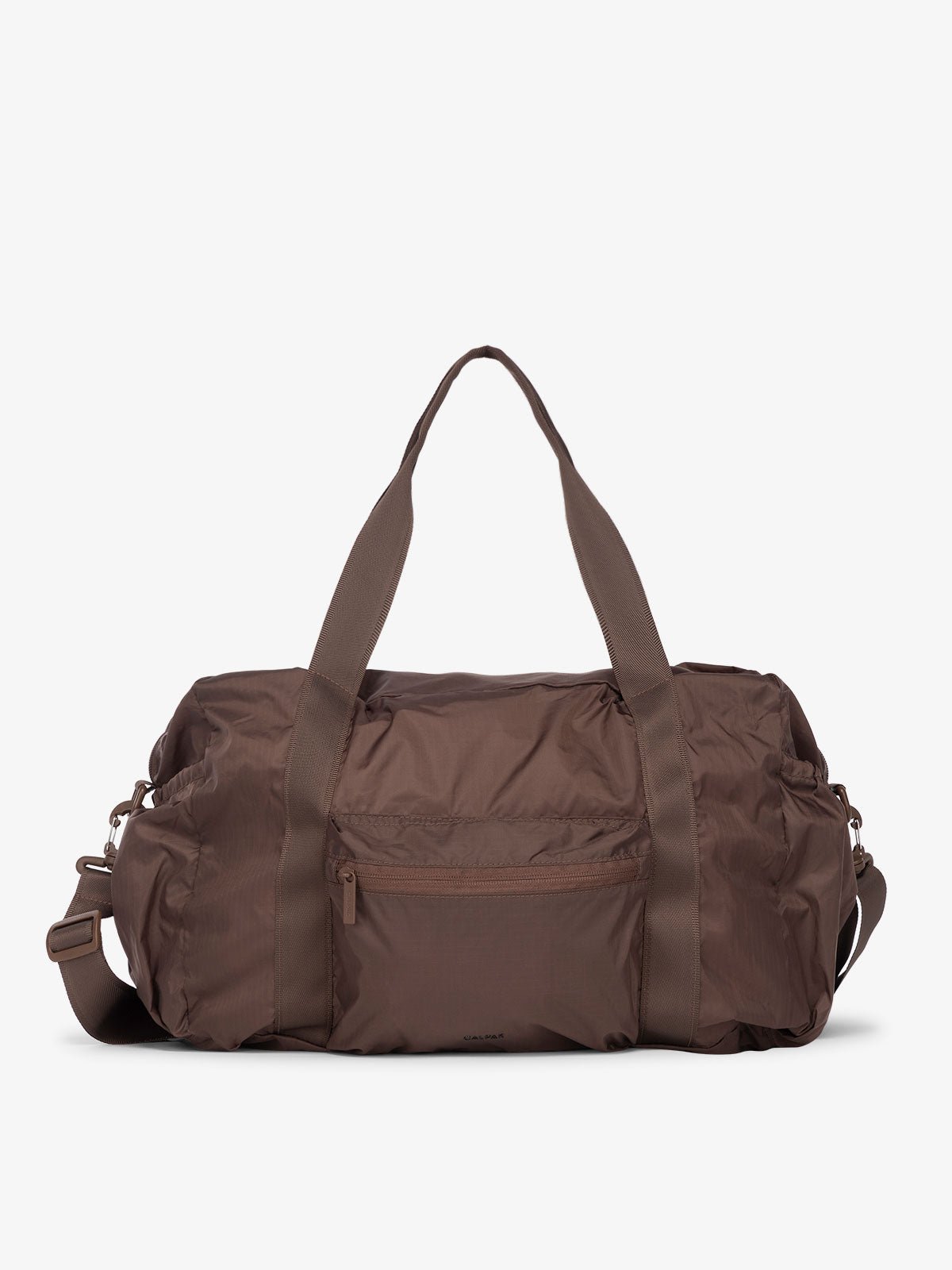 CALPAK Compakt duffel bag with removable crossbody strap and water resistant fabric in walnut