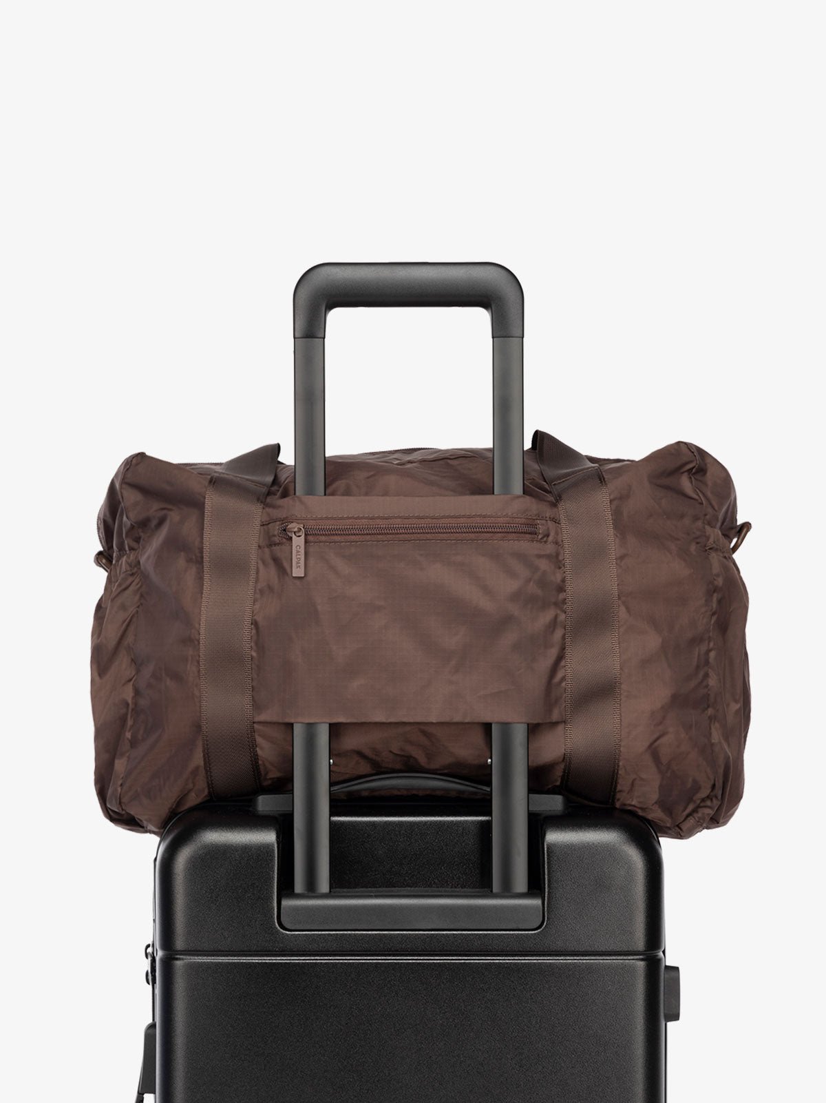 CALPAK Compakt nylon duffle bag with  trolley sleeve in walnut brown