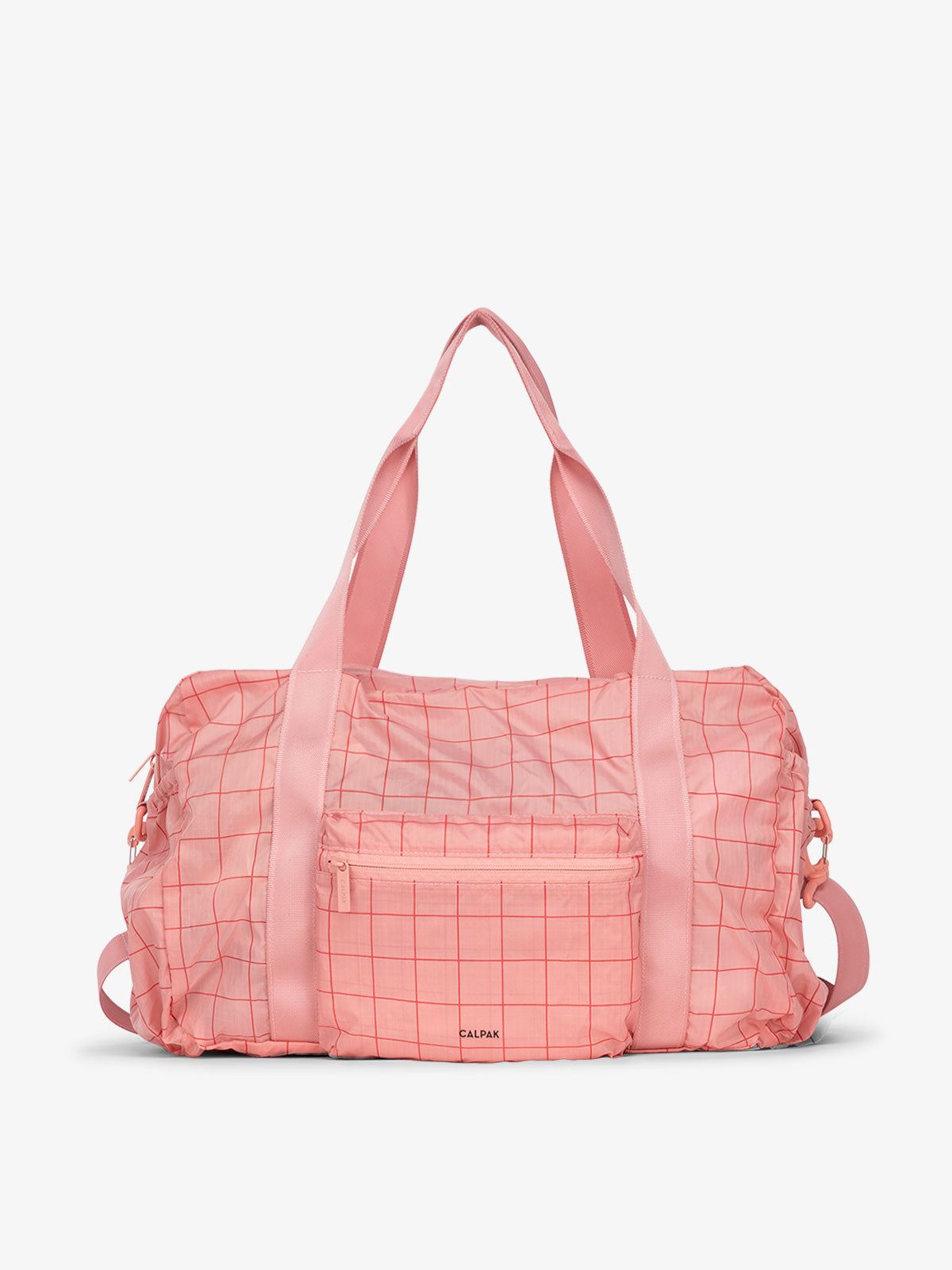 CALPAK Compakt duffel bag with removable crossbody strap and water resistant fabric in pink grid