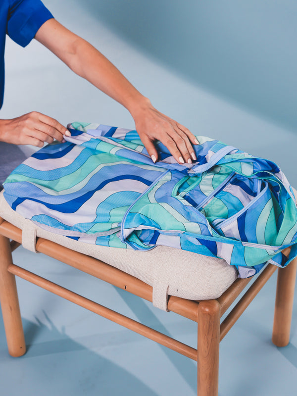 CALPAK folding compakt tote bag in wavy blue pattern