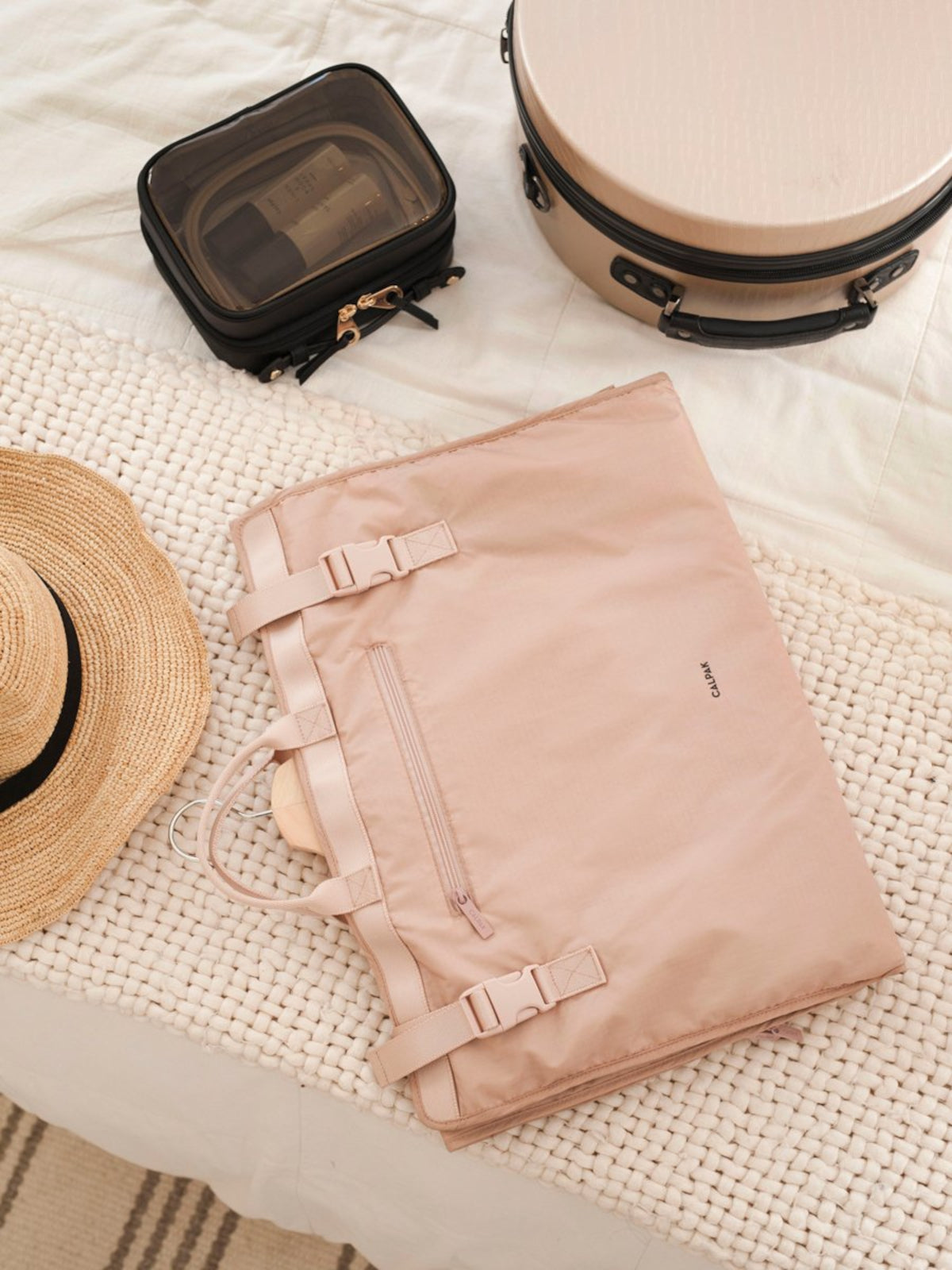 carry-on garment bag for trips in light pink mauve