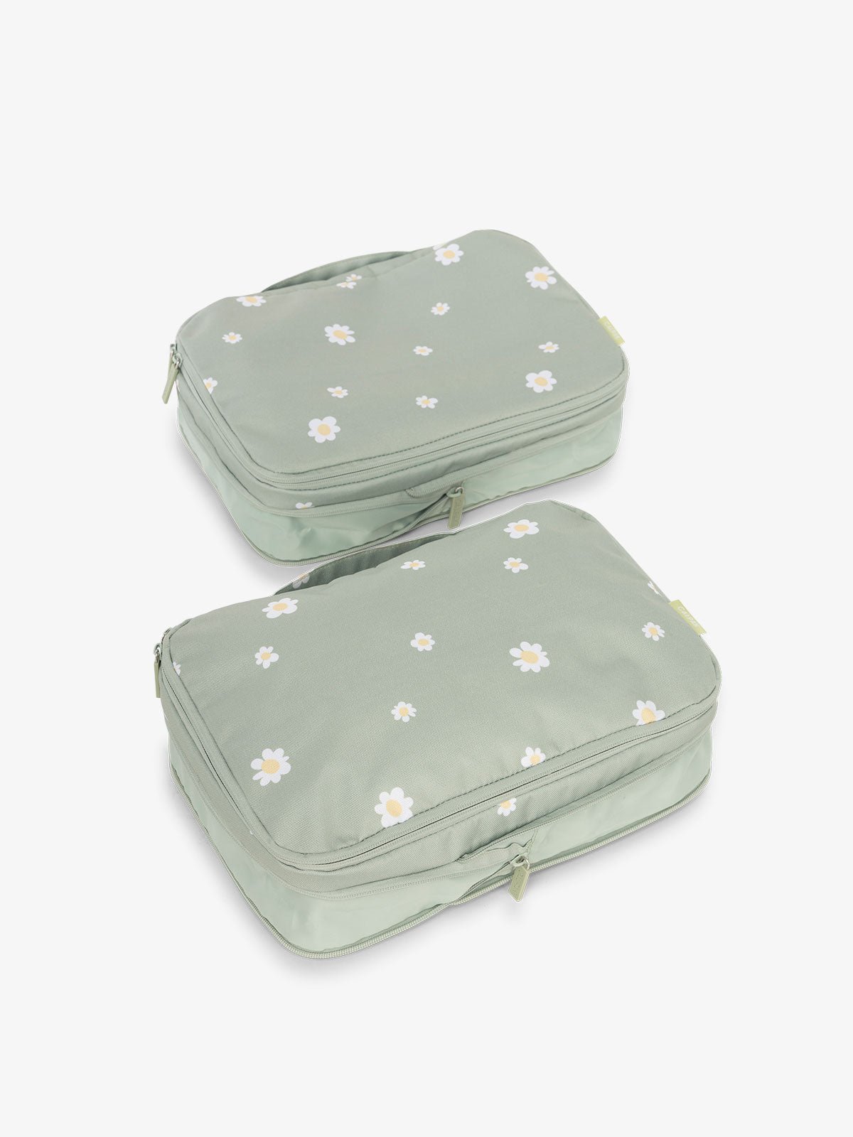 CALPAK compression packing cubes with handles in green daisy floral print