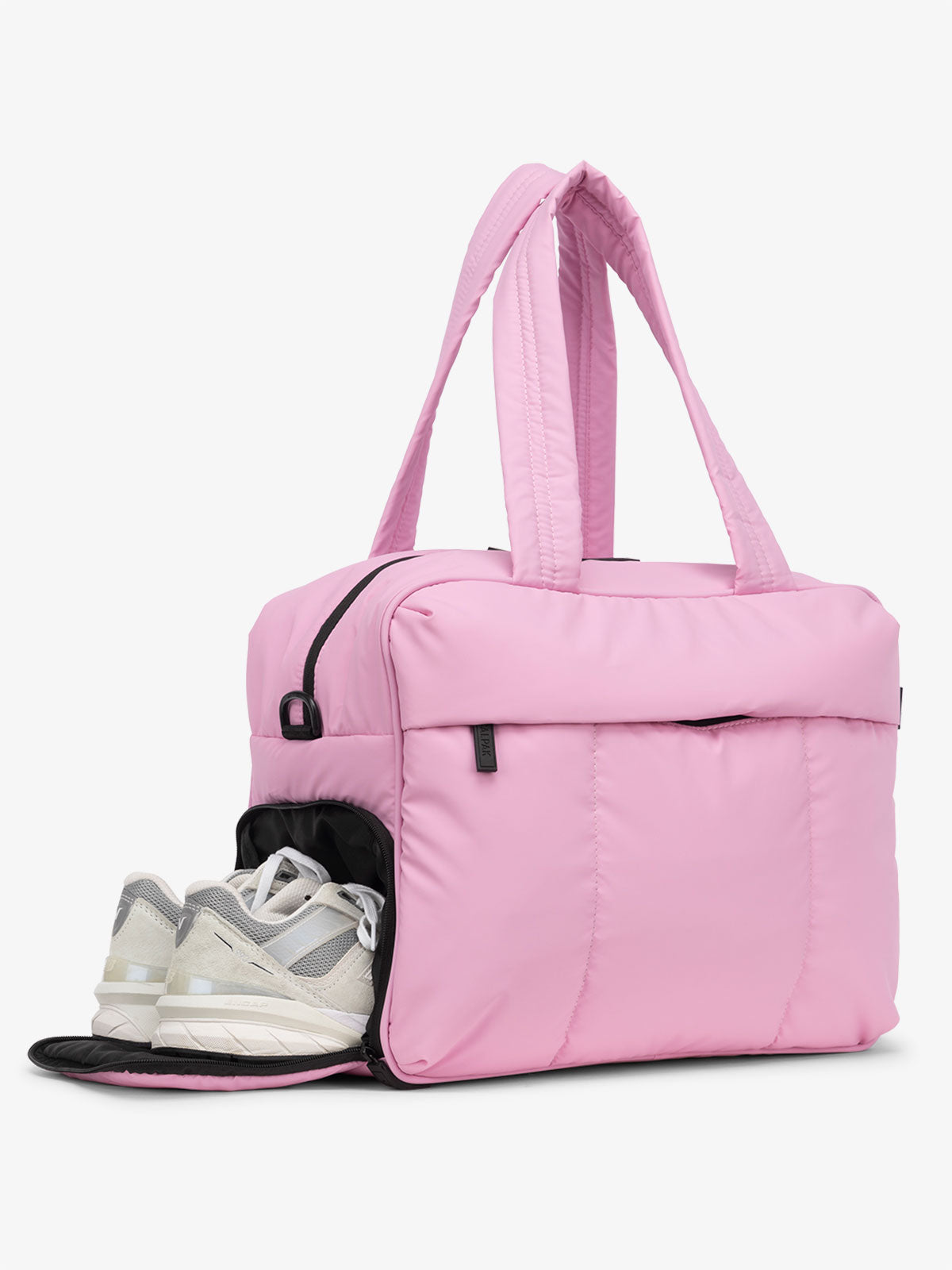 CALPAK Luka Duffel Bag with side shoe compartment and top handles in bubblegum pink
