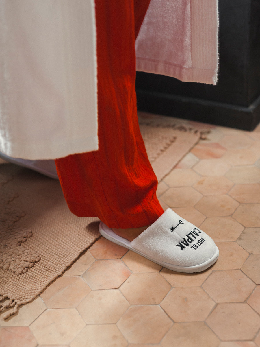 soft white Hotel CALPAK slippers