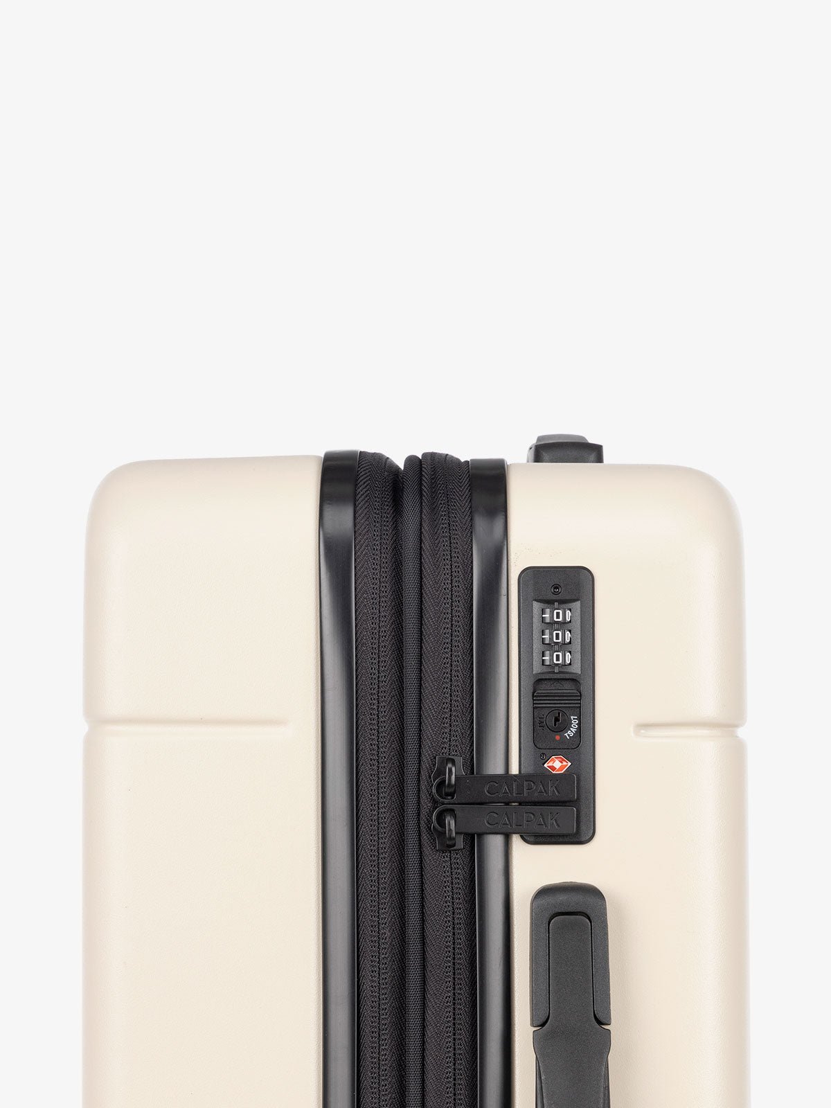 TSA lock of CALPAK Hue hard side carry-on luggage with spinner wheels in linen cream