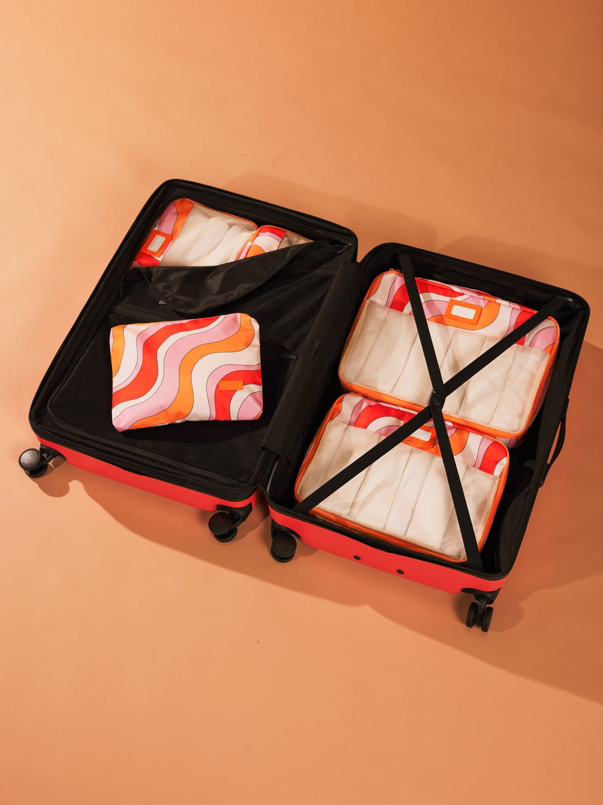 large hardside polycarbonate suitcase with compression straps