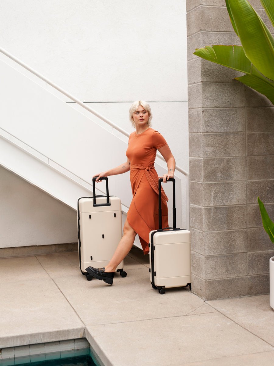 model with check in suitcase and trunk luggage from Hue luggage collection
