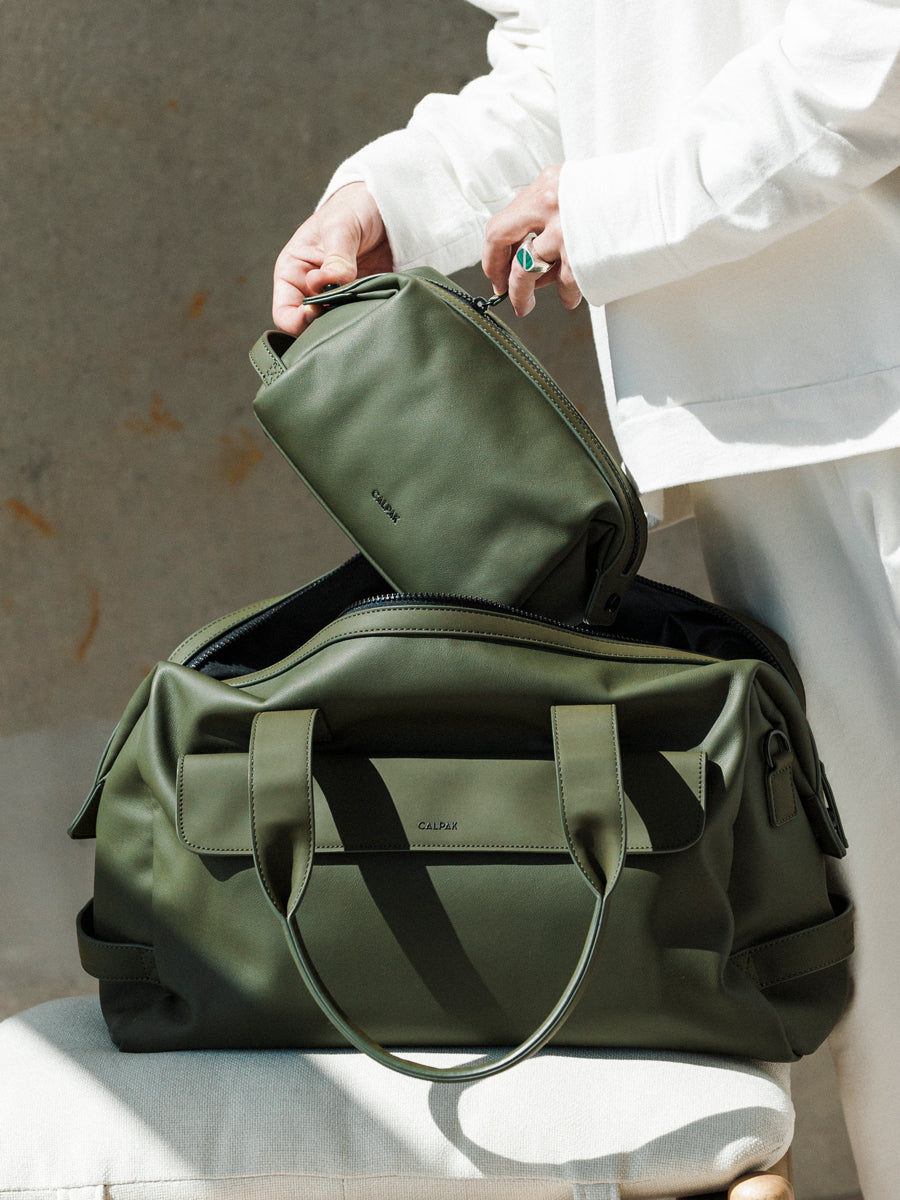 example of packed CALPAK Hue duffel bag in green moss color