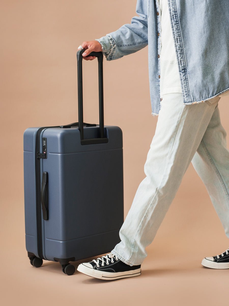 medium 26 inch hardshell stylish minimalist CALPAK Hue suitcase in blue atlantic