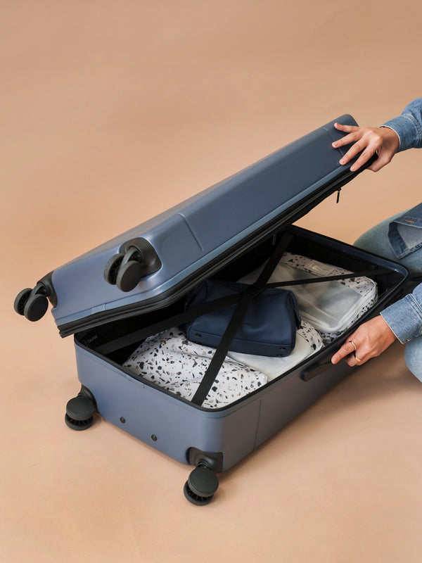 CALPAK Hue Trunk hardside suitcase with compression straps