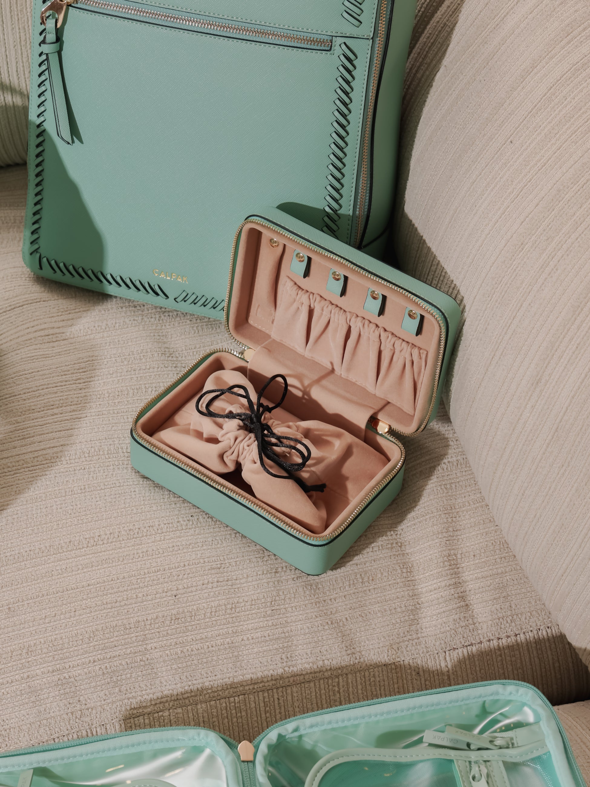 CALPAK travel jewelry case with drawstring pouch in aqua