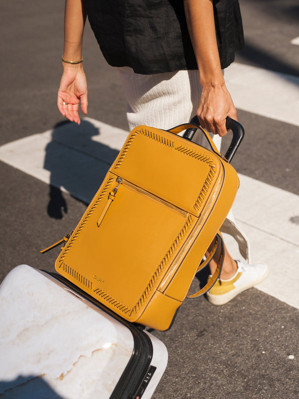 CALPAK Kaya faux leather laptop backpack in yellow