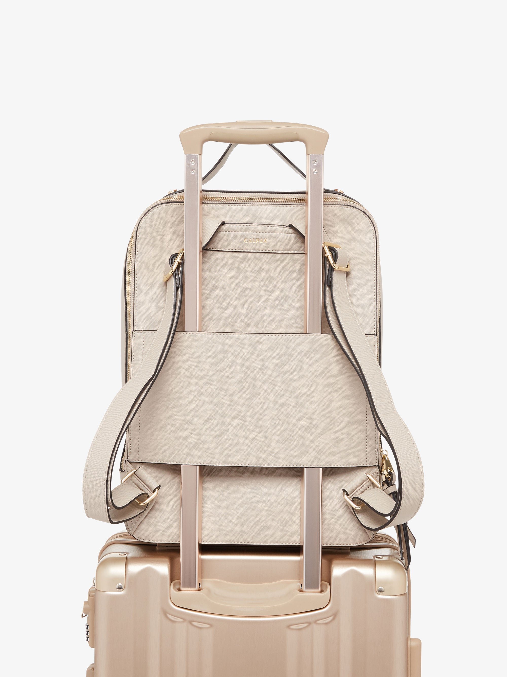 beige stone CALPAK Kaya laptop backpack with luggage trolley sleeve