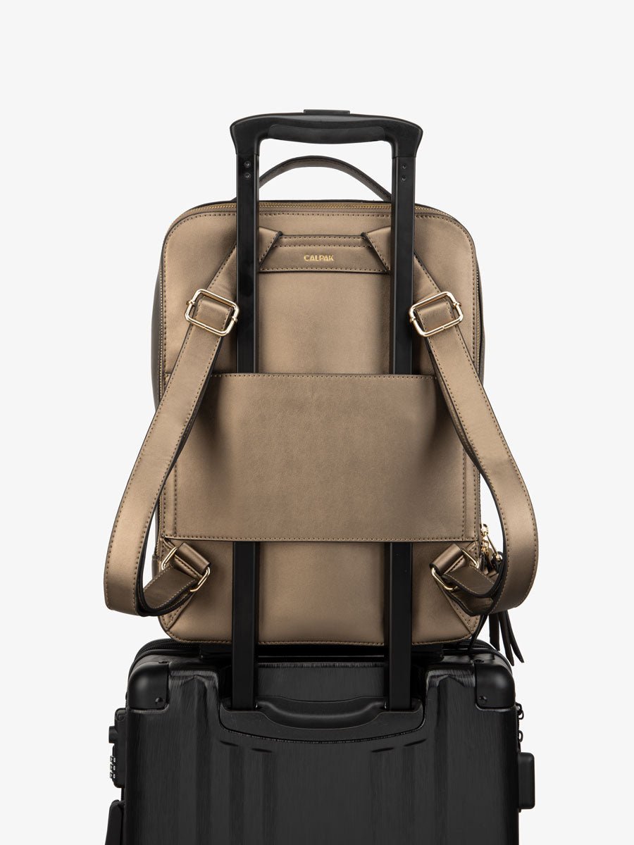 bronze CALPAK Kaya laptop backpack for travel with trolley sleeve