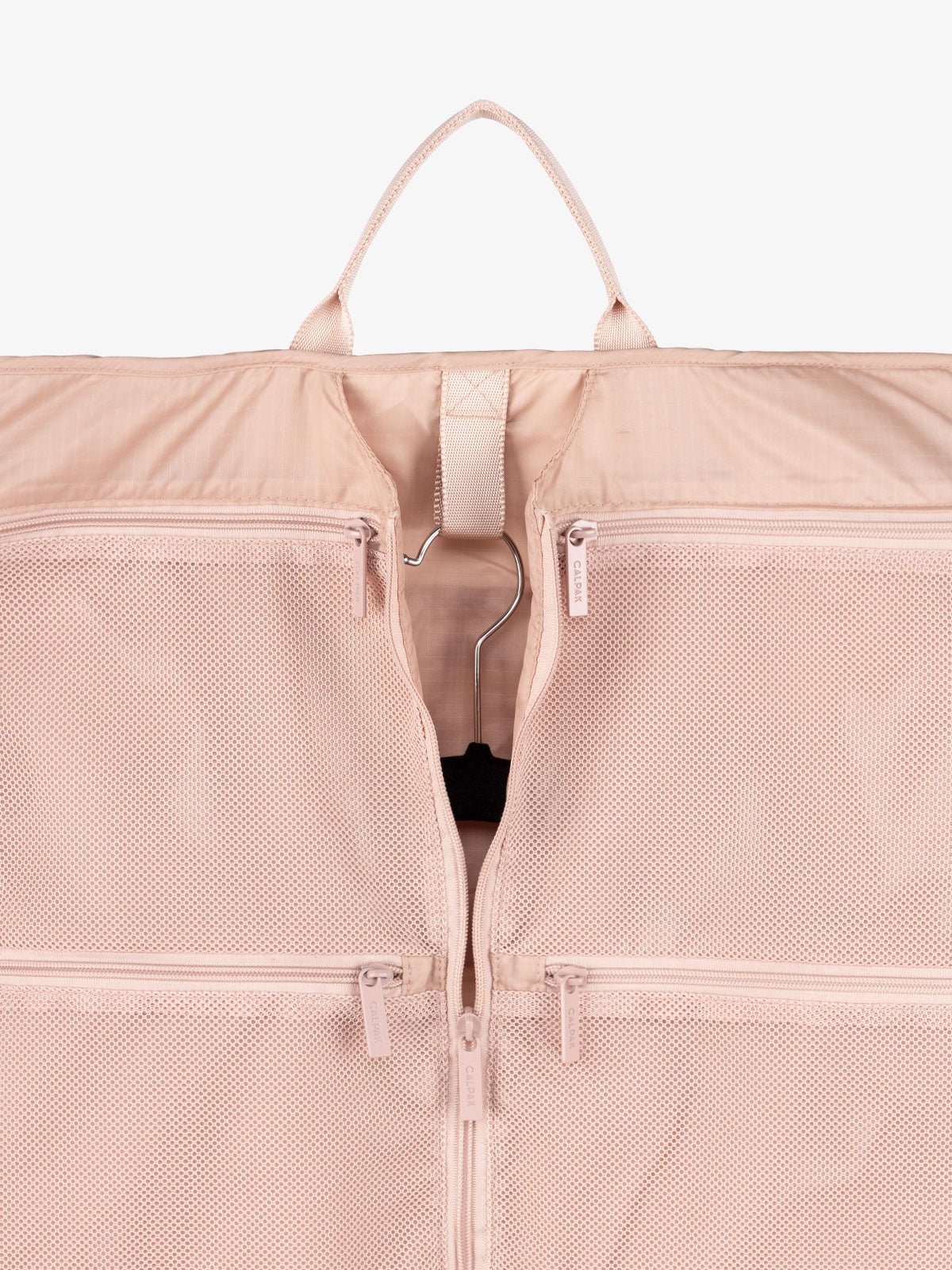 garment storage with handle and mesh pockets in light pink