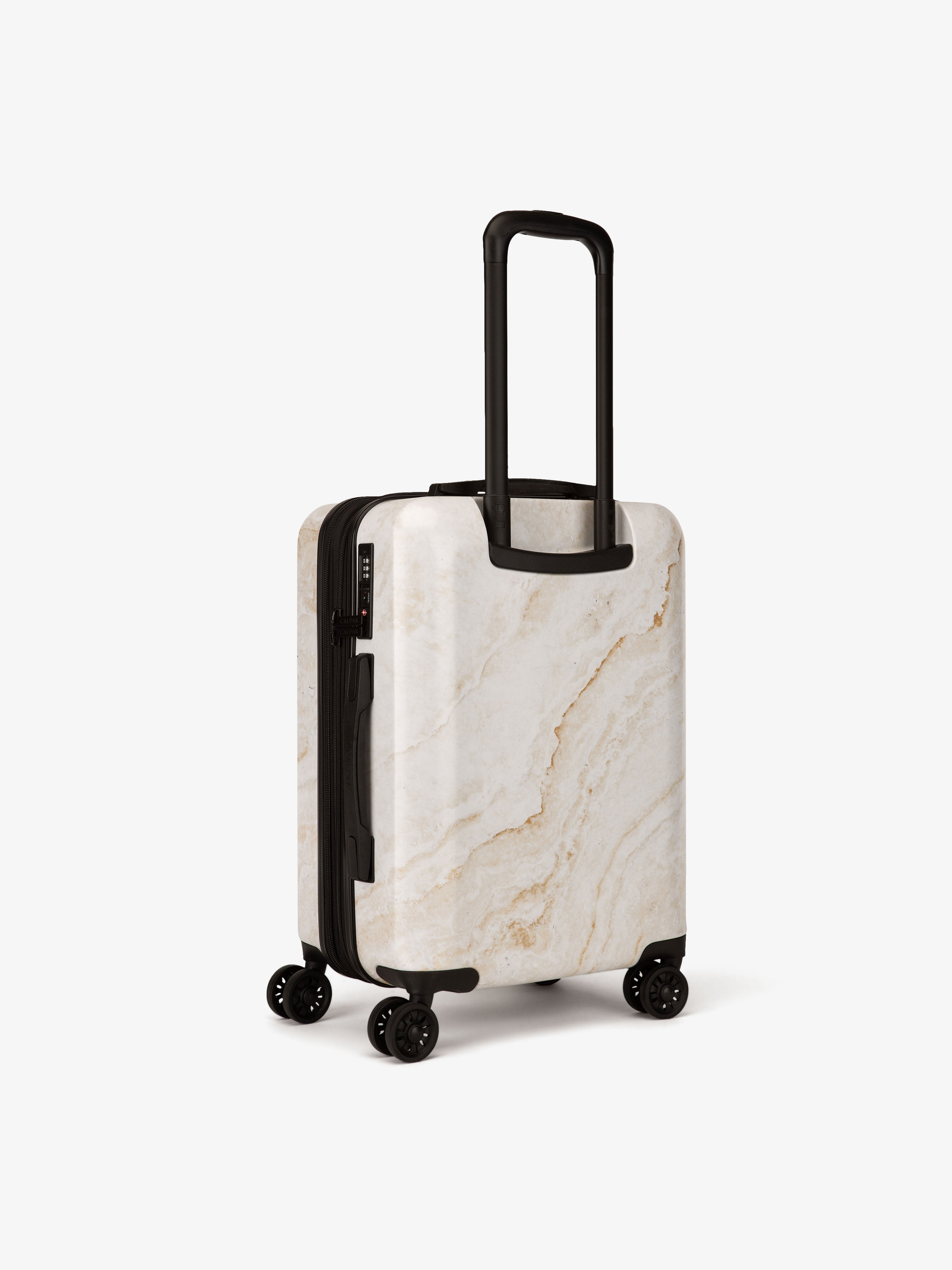CALPAK gold marble hard shell carry-on suitcase with spinner wheels