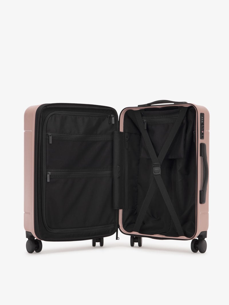 pink CALPAK Hue hardside carry on suitcase with laptop compartment and compression straps