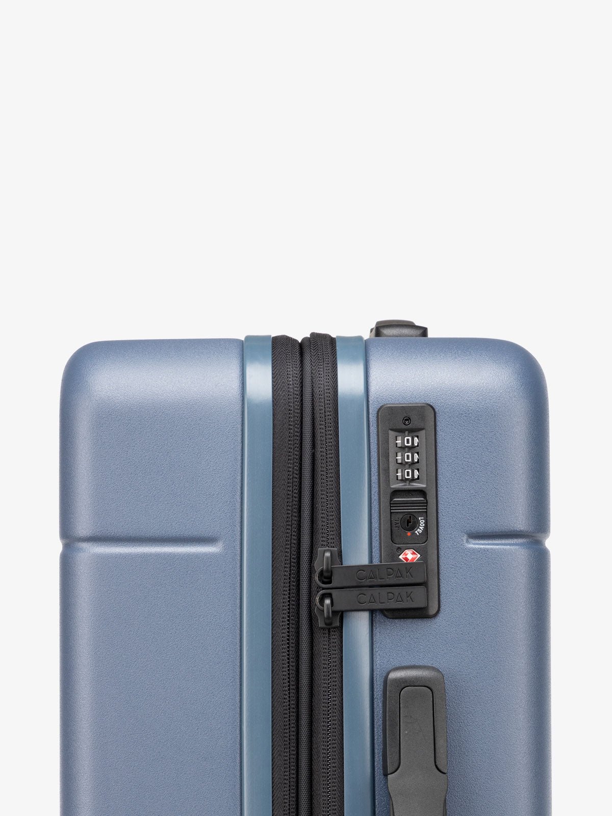 TSA lock of CALPAK Hue hard side carry-on luggage with spinner wheels in blue atlantic