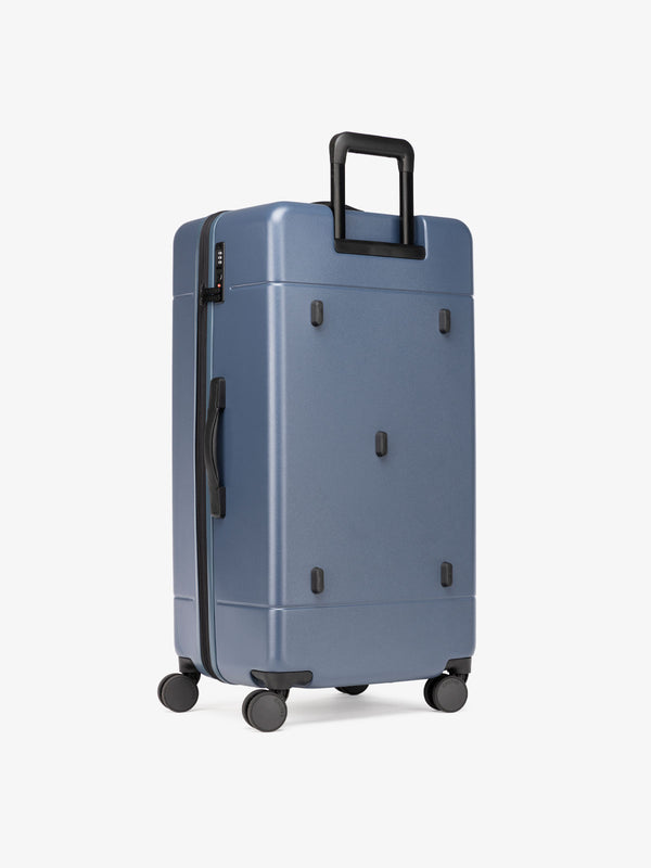 Hue Trunk hard shell luggage with 360 wheels in atlantic blue