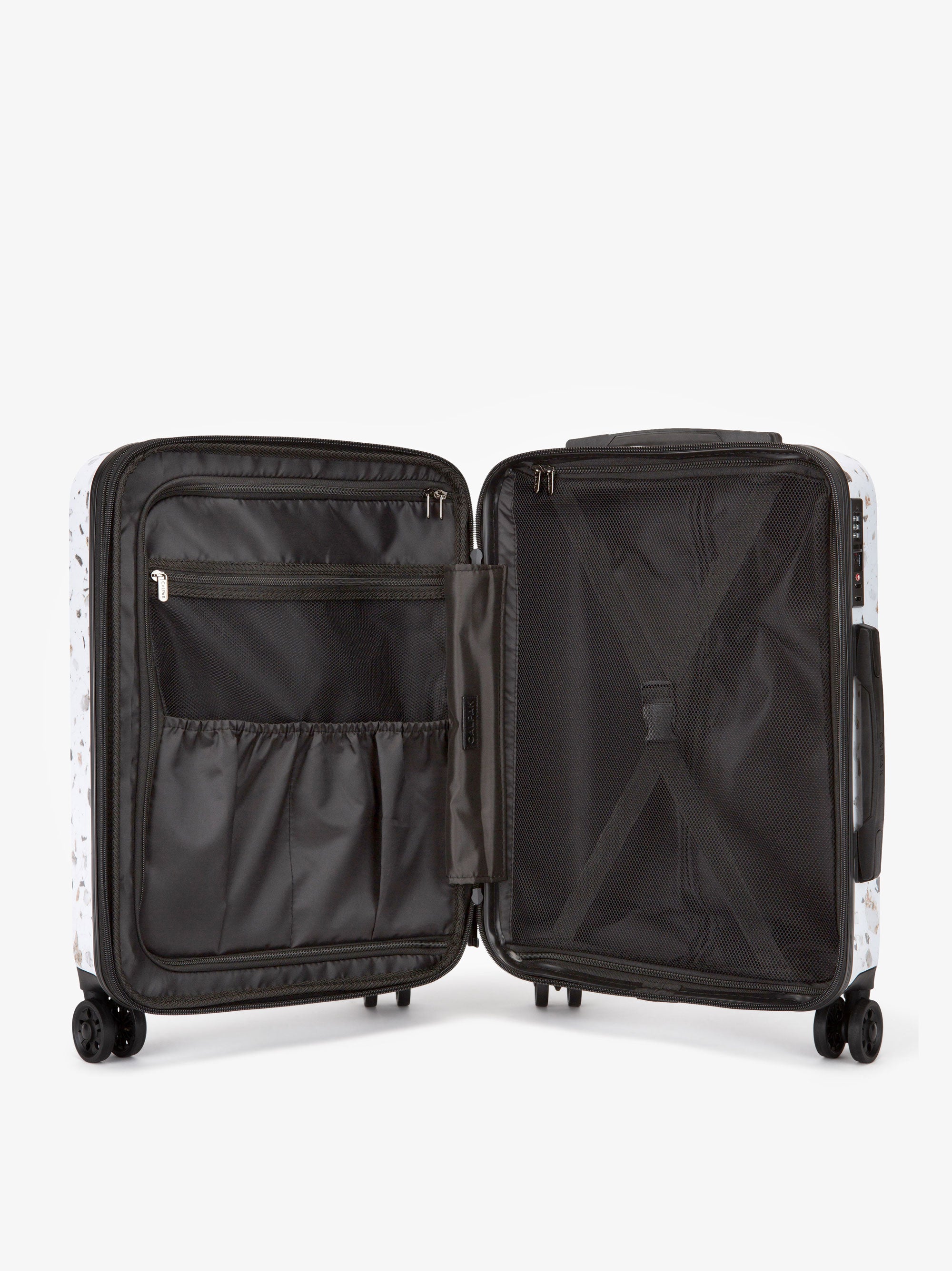 interior of CALPAK hard shell Terrazzo carry-on luggage with compression straps