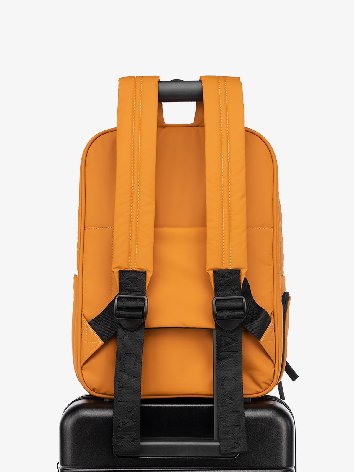 CALPAK Luka Laptop Backpack with luggage sleeve in pumpkin